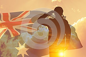 Double exposure of Silhouette of solider and the sunset or the sunrise against Australia flag. Anzac Day.