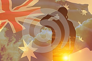 Double exposure of Silhouette of solider and the sunset or the sunrise against Australia flag. Anzac Day.