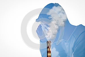 Double exposure. Silhouette of a Young troubled man combined with a smoky chimney