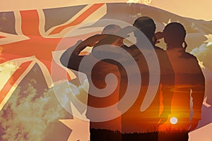 Double exposure of Silhouettes of soliders and the sunset or the sunrise against Australia flag. Anzac Day.