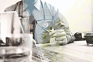 Double exposure of smart medical doctor working with digital tab