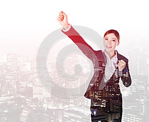 Double exposure of success business woman keeping arms raised with a city