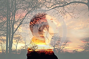 Double exposure of thoughtful woman and landscape with trees. Concept of inner power