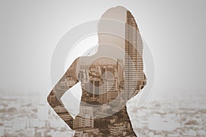 Double exposure of woman and cityscape