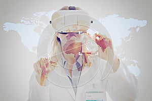 Double exposure of woman doctor using a virtual reality headset and touching two points in a world map and visualizing the