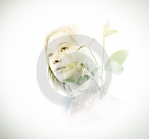 Double exposure of woman with green leaves