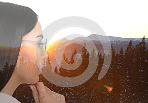 Double exposure of woman and mountain landscape