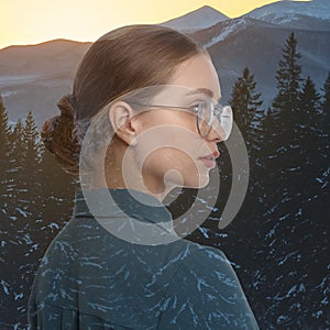 Double exposure of woman and mountain landscape