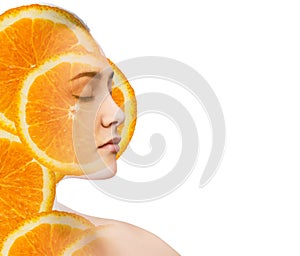 Double exposure of woman with orange fruit slices.