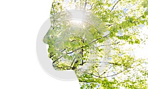 Double exposure woman profile with tree foliage