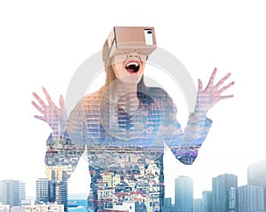 Double exposure of woman using virtual reality headset and cityscape