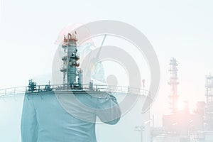 Double exposure workers hand holding walkie talkie, communication in oil refinery plant