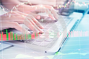 Double exposure yong businessmen calculate about cost and stock market