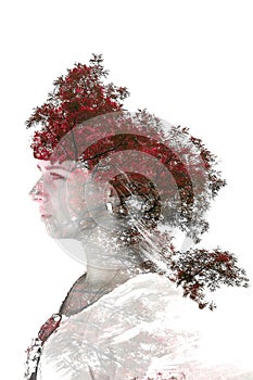 Double exposure of young beautiful girl among the leaves and trees. Portrait of a woman, mysterious look, creative, art, conceptua