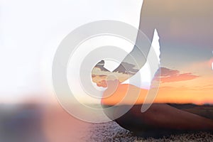 Double exposure of young woman practicing yoga in nature