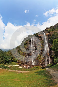 Double falls in mountains. The photo is made by a lens Fisheye