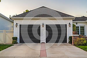 Double garage with short driveway in day