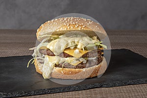 Double hamburger with beef isolated in natural light photo