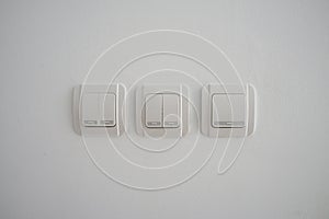 Double light switch on gray wall
