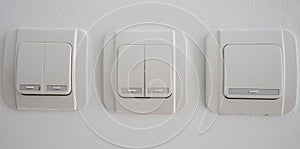 Double light switch on gray wall