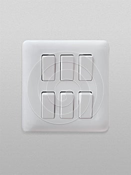 Double light switch on white background on white cement background