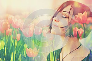 Double multiply exposure portrait of a dreamy cute woman meditating outdoors with eyes closed, combined with photograph of tulip