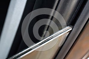 Double pane window or double glassed or double glazed window with two slates of glass of luxury modern car as method of noise photo