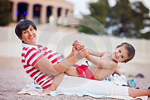 Double portrait of grandmother and child on the beach