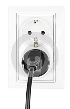 Double power European electric plug isolated on a white. Black electric cord plugged into a white electricity socket on white