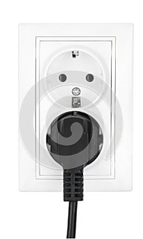 Double power European electric plug isolated on a white. Black electric cord plugged into a white electricity socket on white