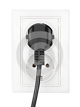 Double power European electric plug isolated on a white. Black electric cord plugged into a white electricity socket on white