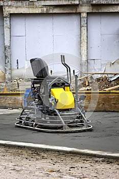 Double power trowel finishing concrete floor smooth concrete surface.