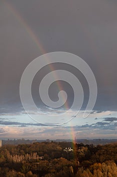 Double rainbow against the sunset sky. Leprechaun at the end of the rainbow. Rainbow as a concept of fantastic money