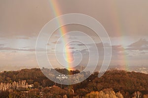 Double rainbow against the sunset sky. Leprechaun at the end of the rainbow. Rainbow as a concept of fantastic money