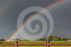 Double rainbow on a beautiful hills scenery in Italy