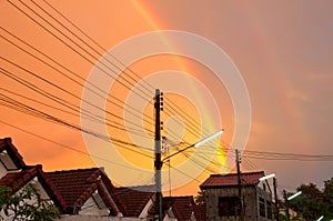 Double rainbow at color gold sky.