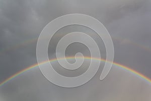Double rainbow and dark sky