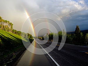 Double Rainbow driving in mountains on road