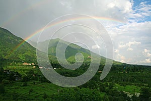 Double rainbow on lush green himalayan valley