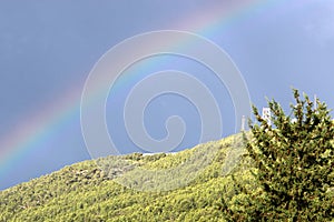 Double rainbow in the mountains after rain