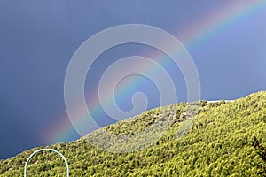 Double rainbow in the mountains after rain