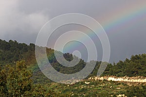 Double rainbow in the mountains after rain