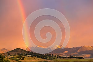 A double rainbow and mountains in the town of Clarens, South Africa