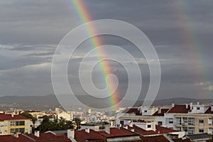 Double rainbow over buildings