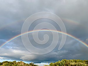 Double Rainbow over a dark sky