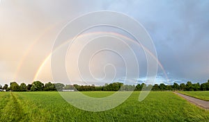 Double rainbow over the fields, on the outskirts of hohenkirchen village, panorama landscape