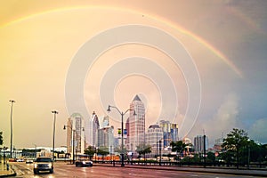 Double rainbow over the midtown in Atlanta, USA during a rainy evening