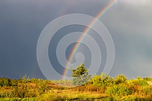 Double rainbow over the stormy sky