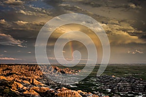 Double rainbow rain cloud, Badlands National Park, South Dakota