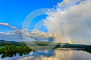 Double Rainbow on a river in the country